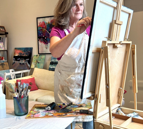 Lori Fopiano painting in her studio